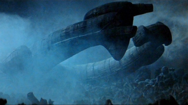 The Engineer ship crashing on LV-426, with an alien escaping into the shadows.